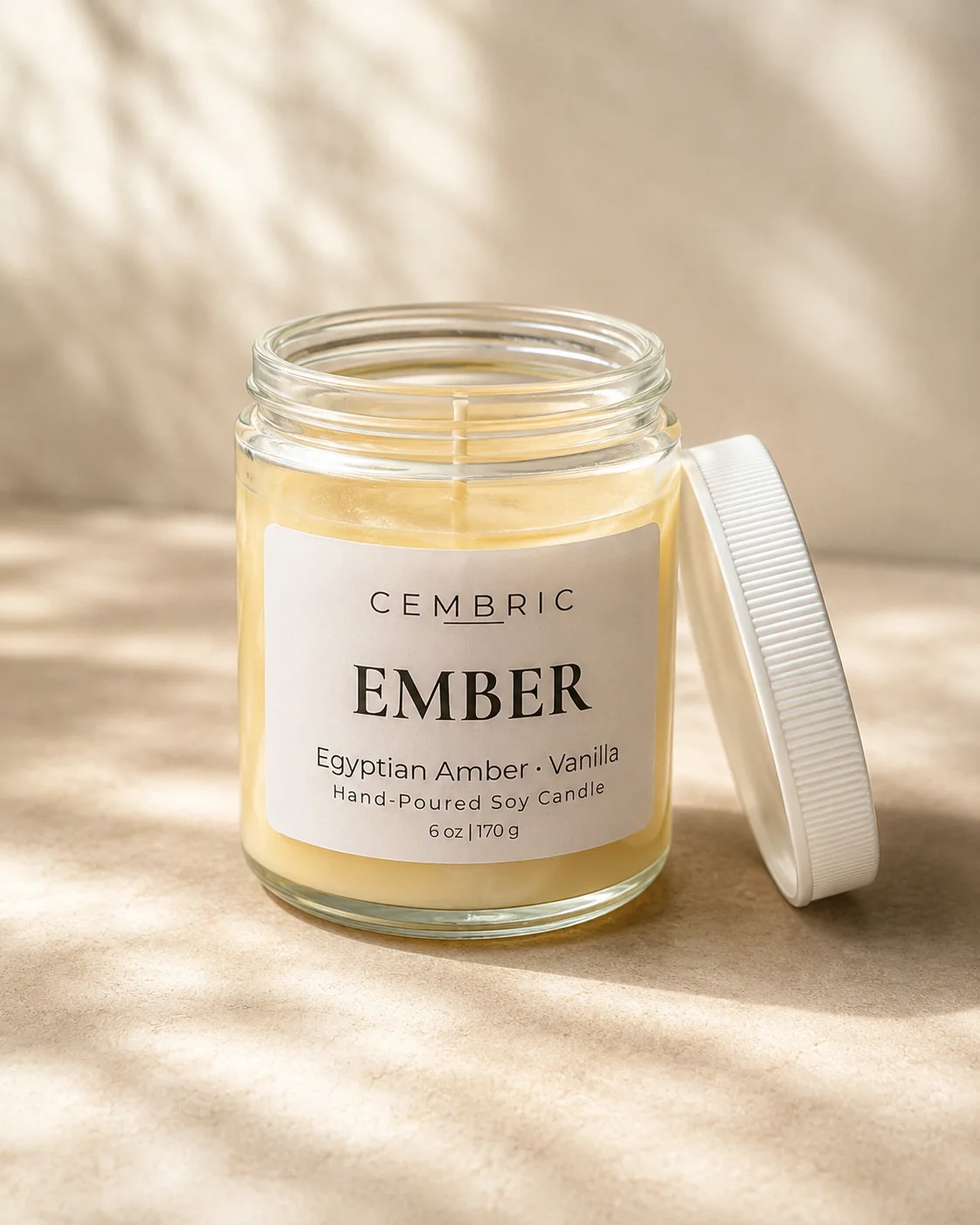 EMBER candle in a clear glass jar with a white lid