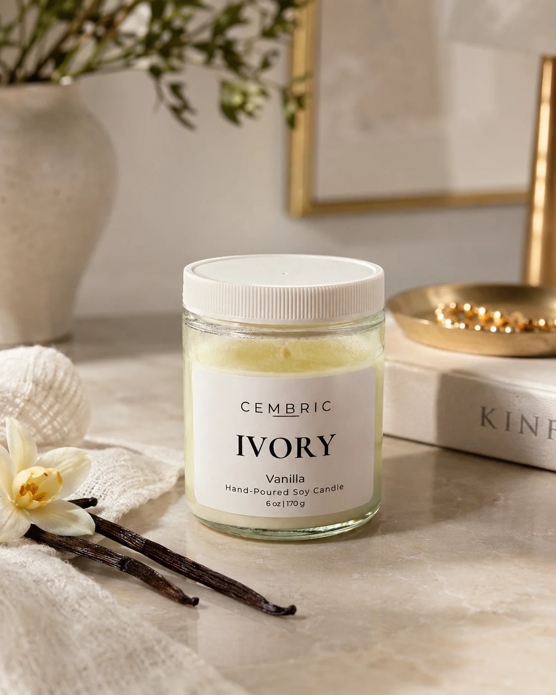 IVORY pure vanilla candle styled with vanilla beans and warm neutral decor