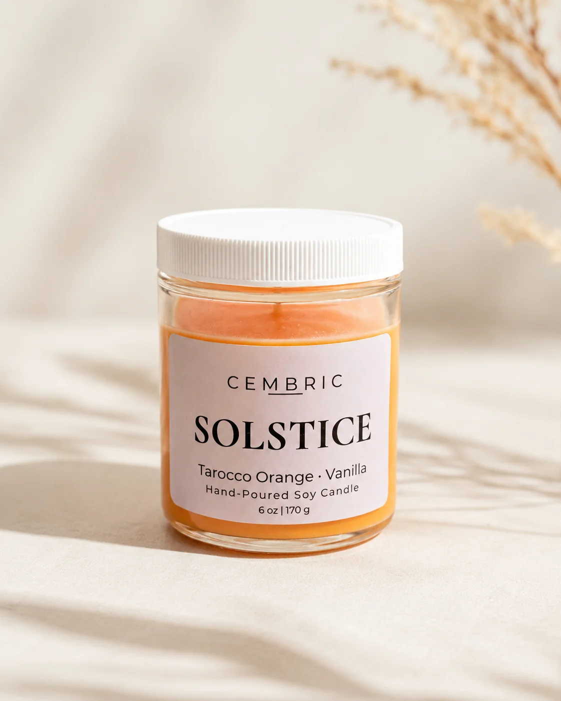 SOLSTICE tarocco orange and vanilla candle in a clear glass jar